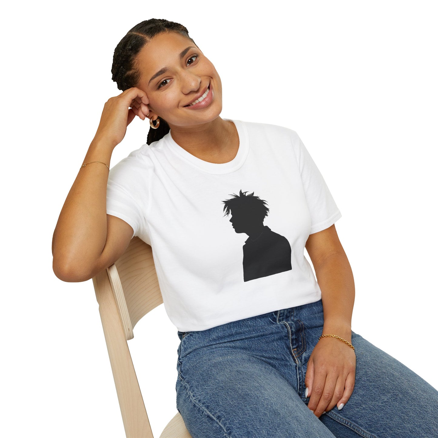 Smiling woman seated on wooden chair wearing white t-shirt with black silhouette graphic and blue jeans