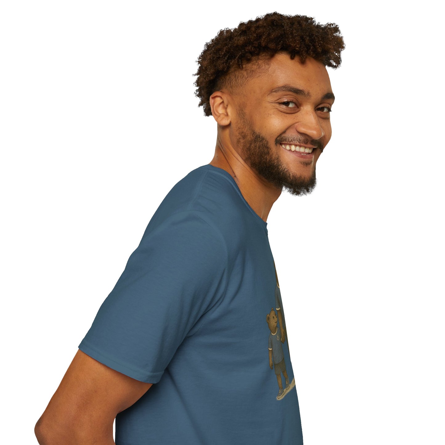 Smiling man in blue t-shirt with bear graphic on white background, side profile view