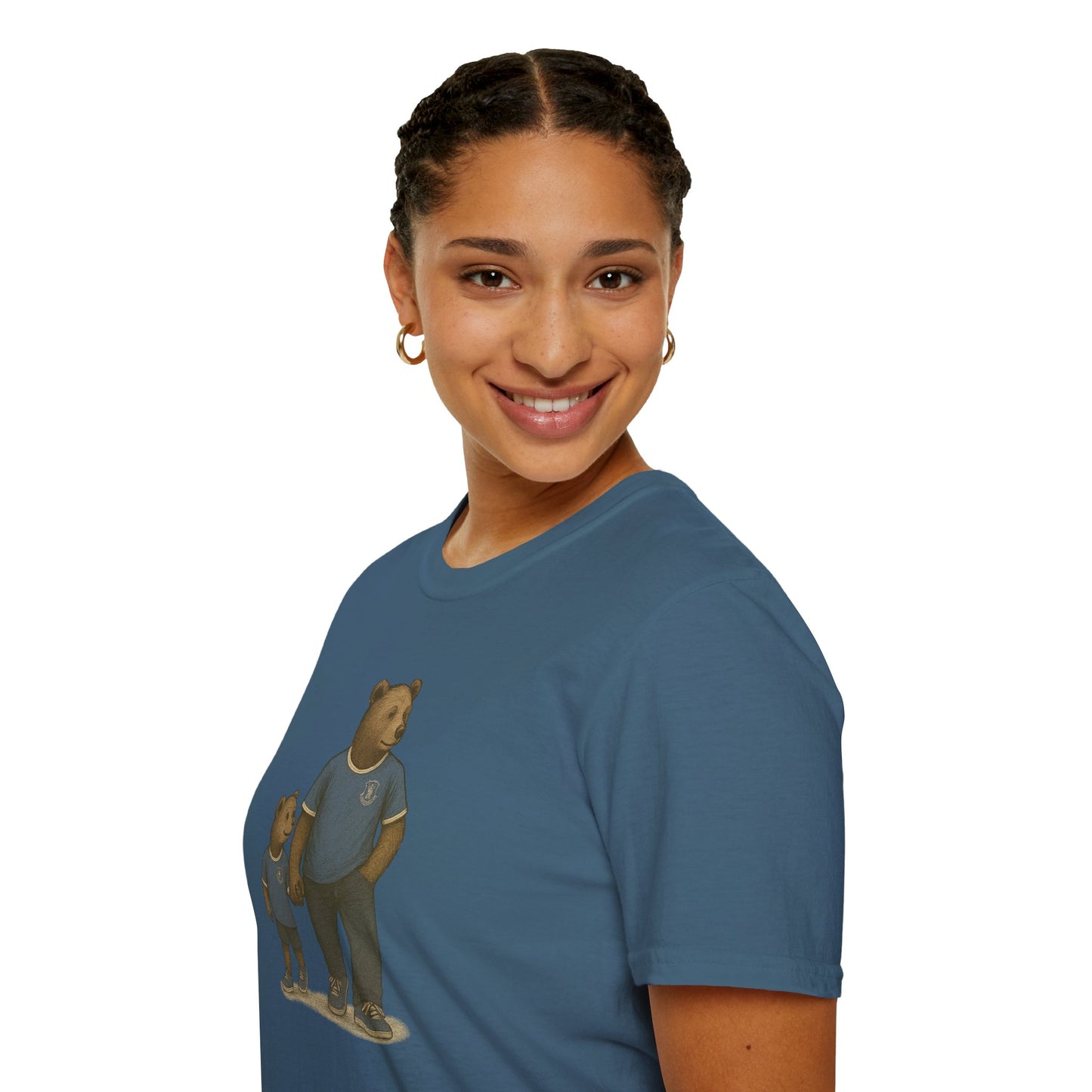 Smiling woman wearing blue t-shirt with bear illustration, gold hoop earrings, isolated on white