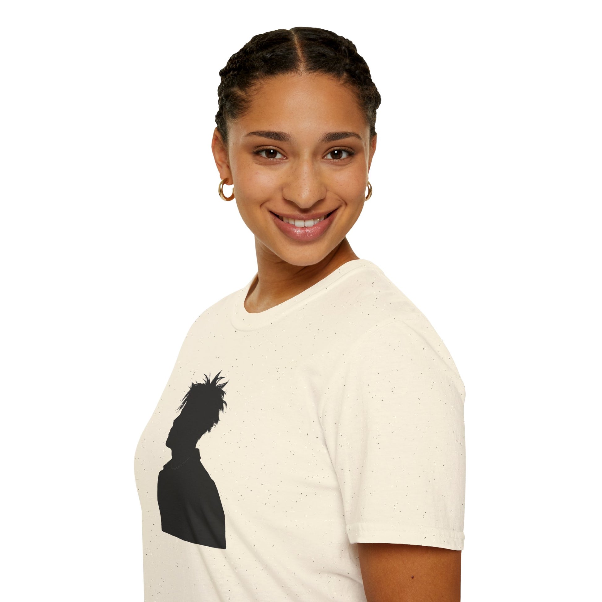 Smiling woman wearing cream t-shirt with black silhouette graphic, gold hoop earrings