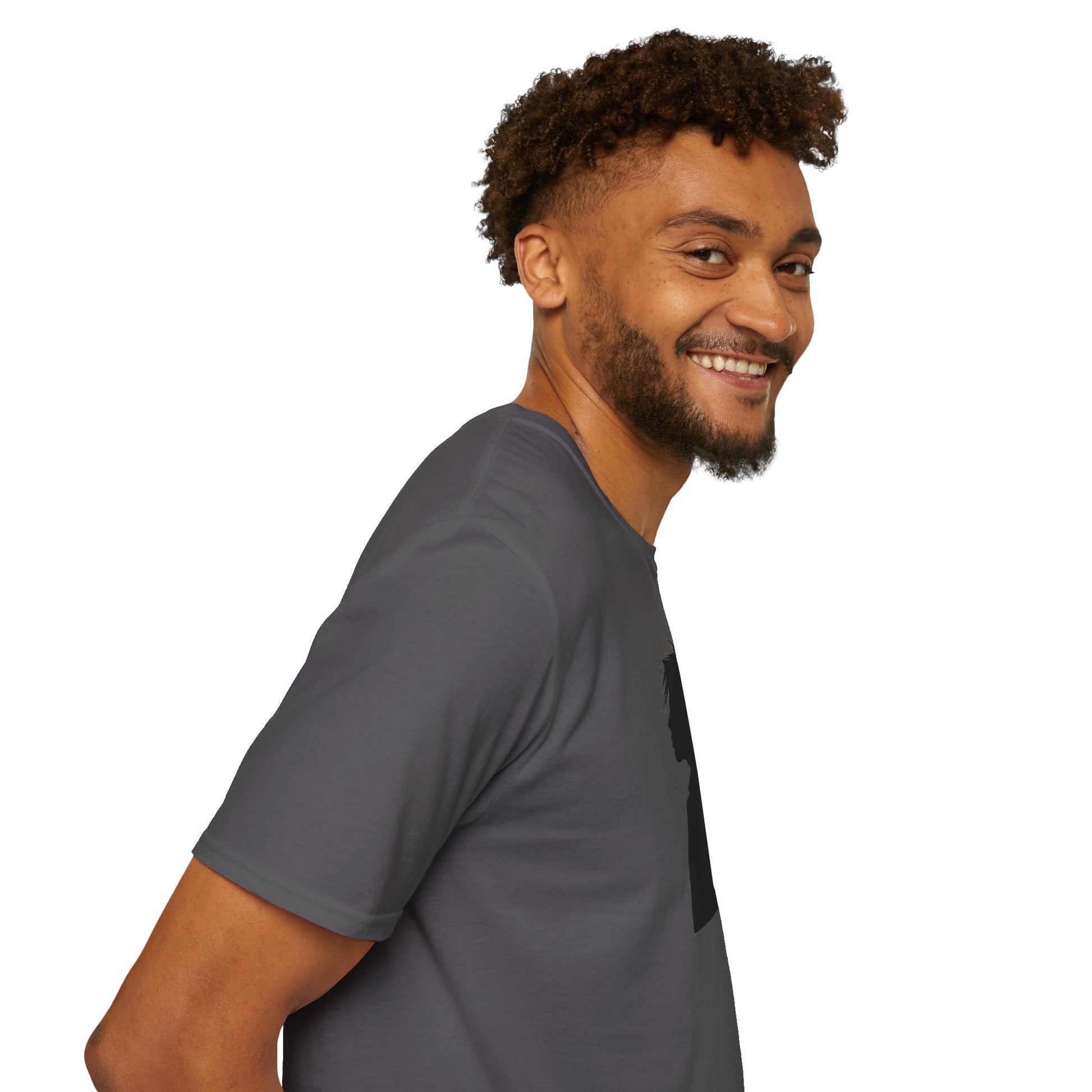 Smiling man with curly hair wearing a gray t-shirt, side profile on white background