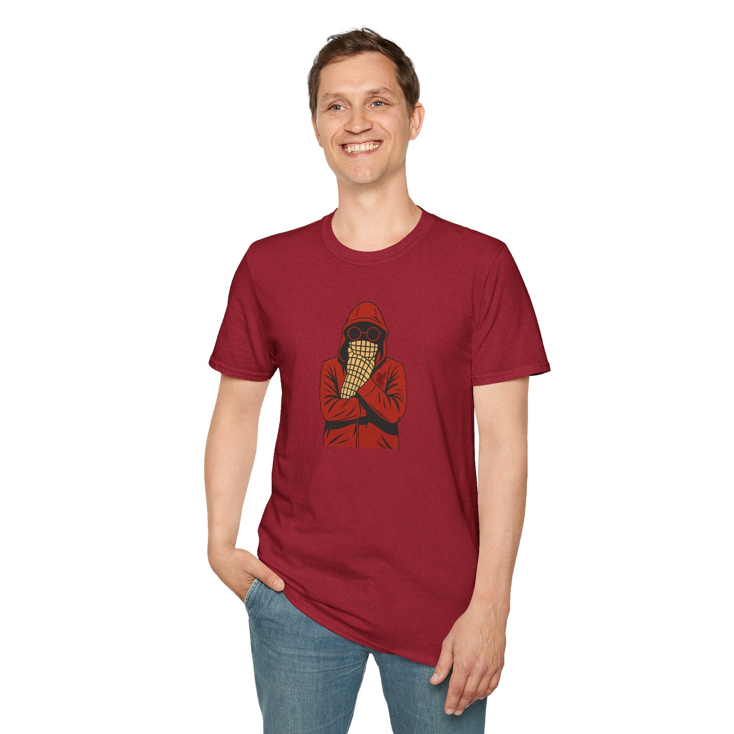 Smiling man wearing maroon t-shirt with hooded figure and scarf graphic, posing in casual jeans