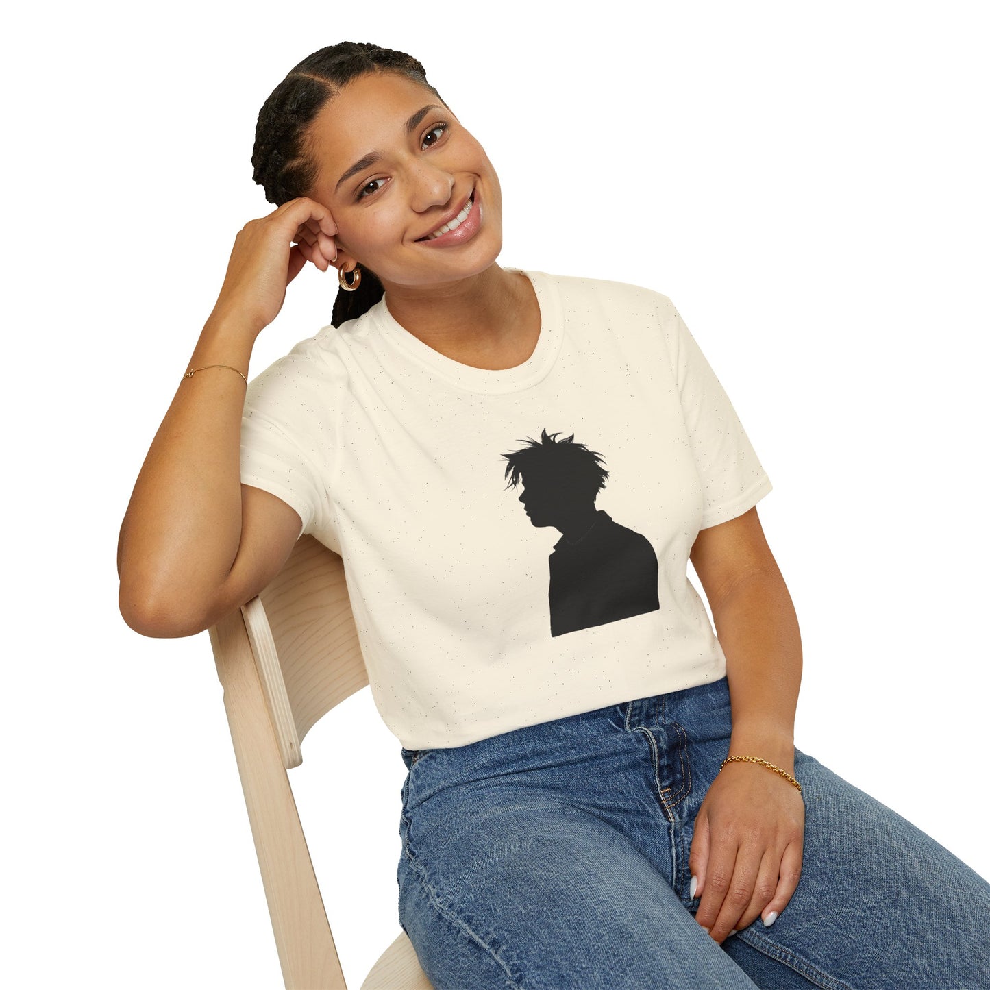 Smiling woman sitting on chair wearing white t-shirt with black silhouette graphic and blue jeans