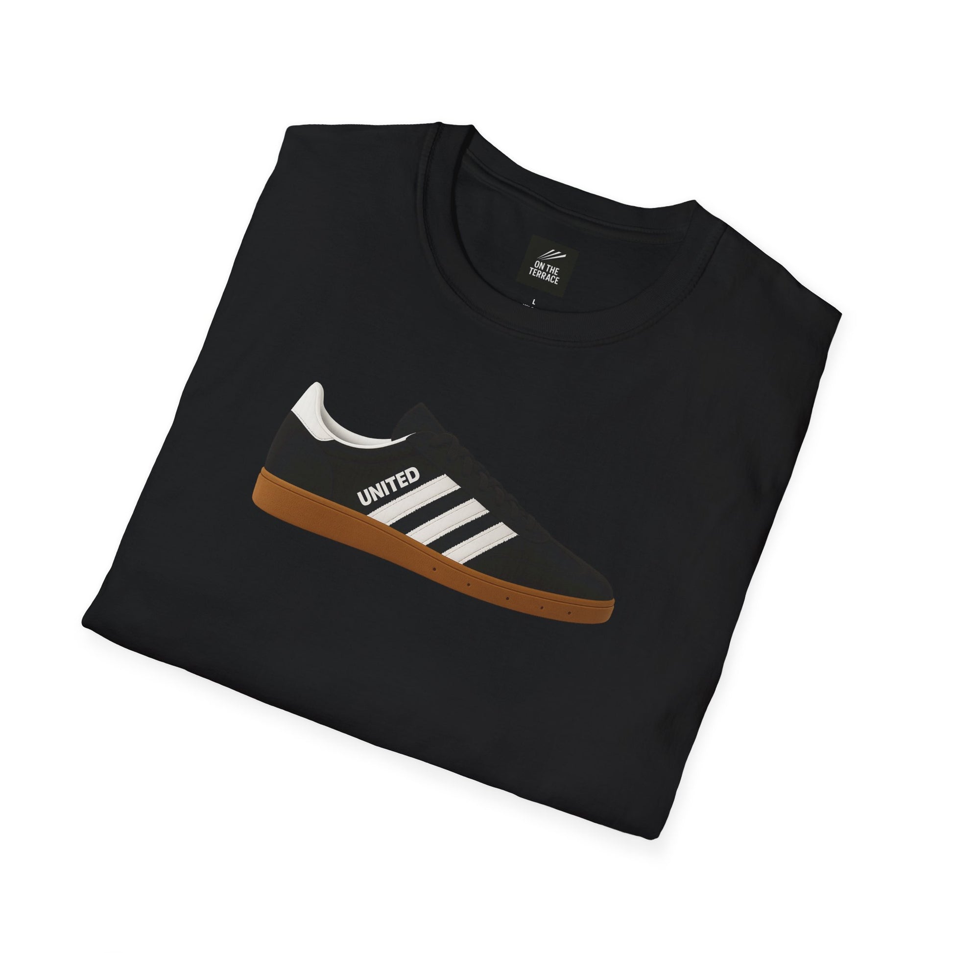 Black folded t-shirt with sneaker graphic featuring white stripes and 'UNITED' text on light brown sole