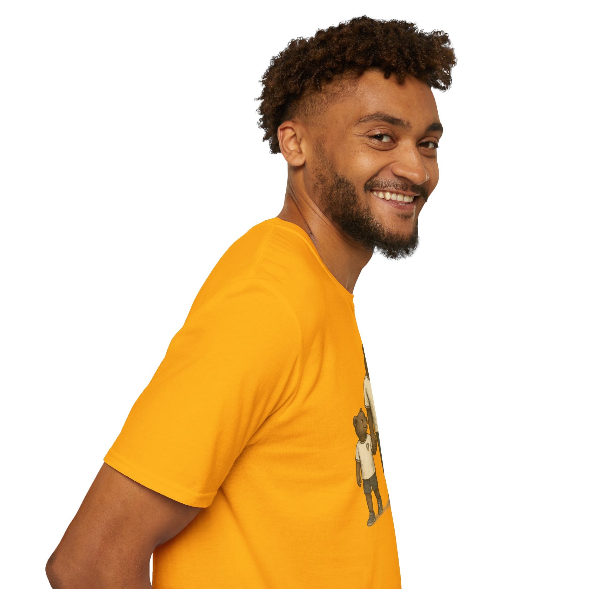 Smiling man with curly hair wearing an orange graphic t-shirt against white background