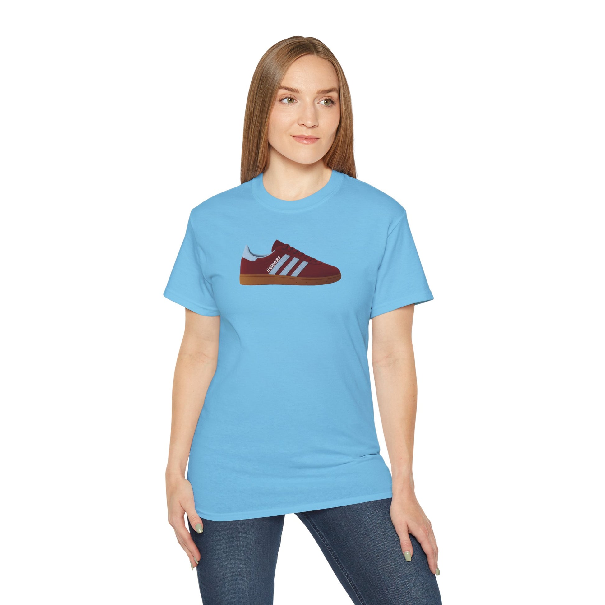 Woman wearing light blue t-shirt with red sneaker graphic and stripes printed on front