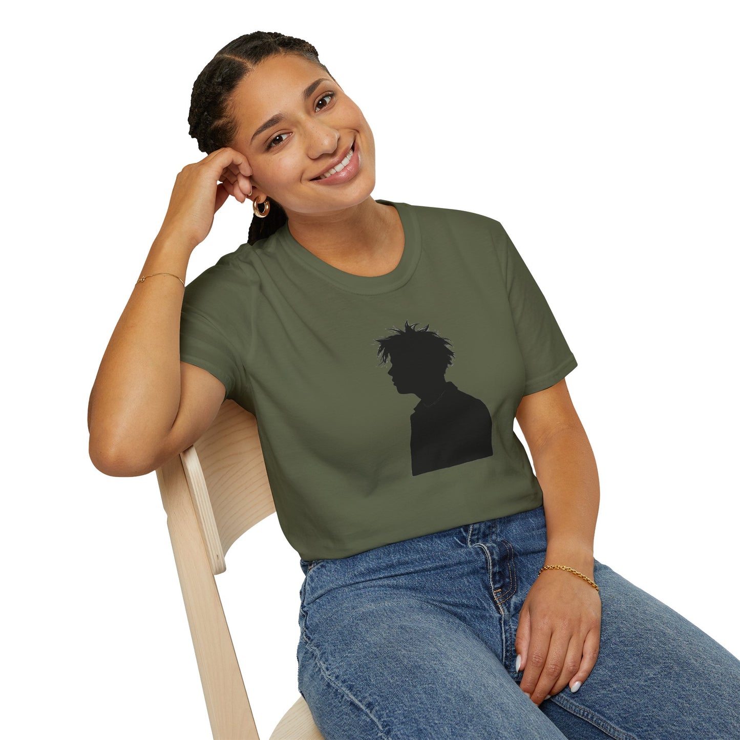 Smiling woman with braided hair wearing olive green t-shirt featuring black silhouette print, sitting on wooden chair