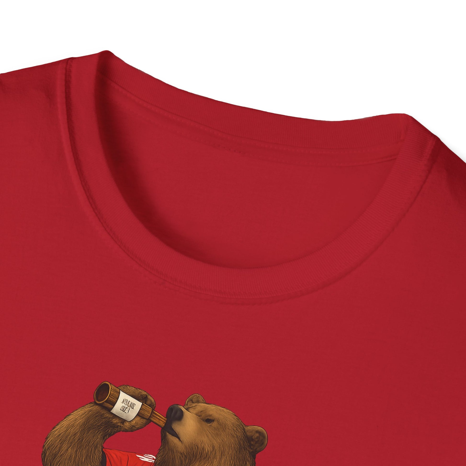 Close-up of red t-shirt with printed bear drinking from a bottle design