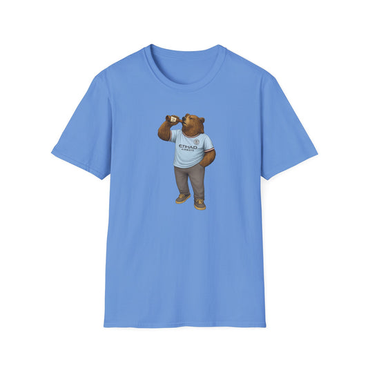 Blue t-shirt with graphic of a bear wearing a Manchester City jersey drinking from a bottle