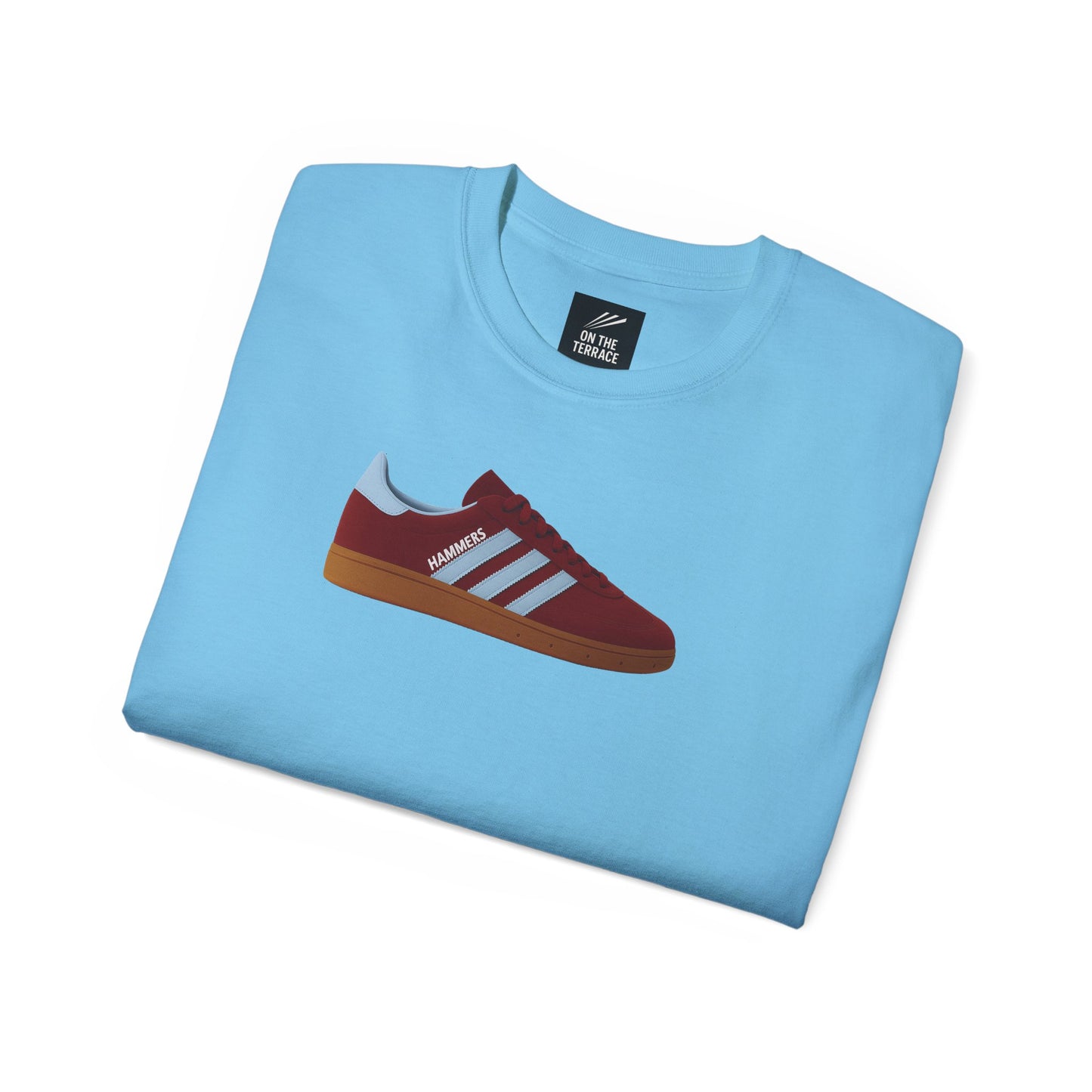 Light blue t-shirt with red and white sneaker graphic and 'HAMMERS' text folded neatly